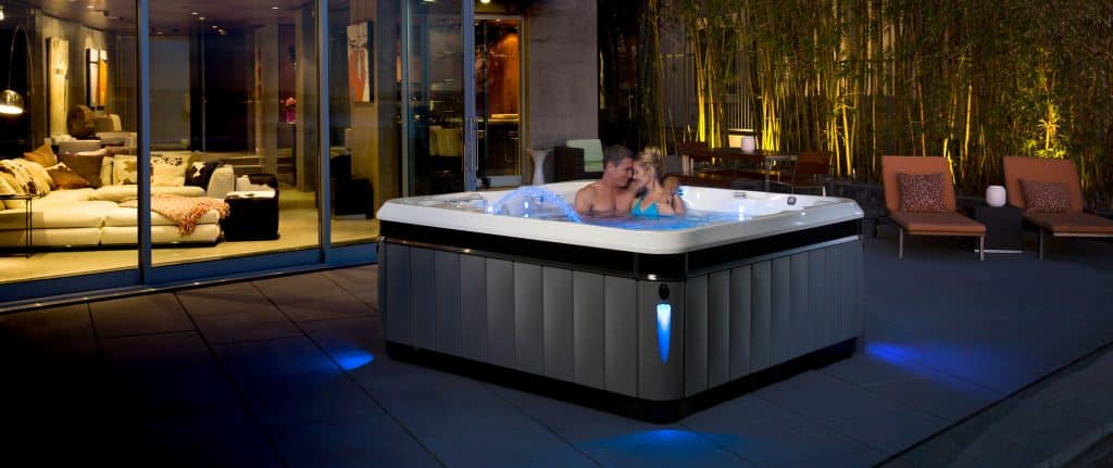 Couple enjoying romantic date in the hot tub