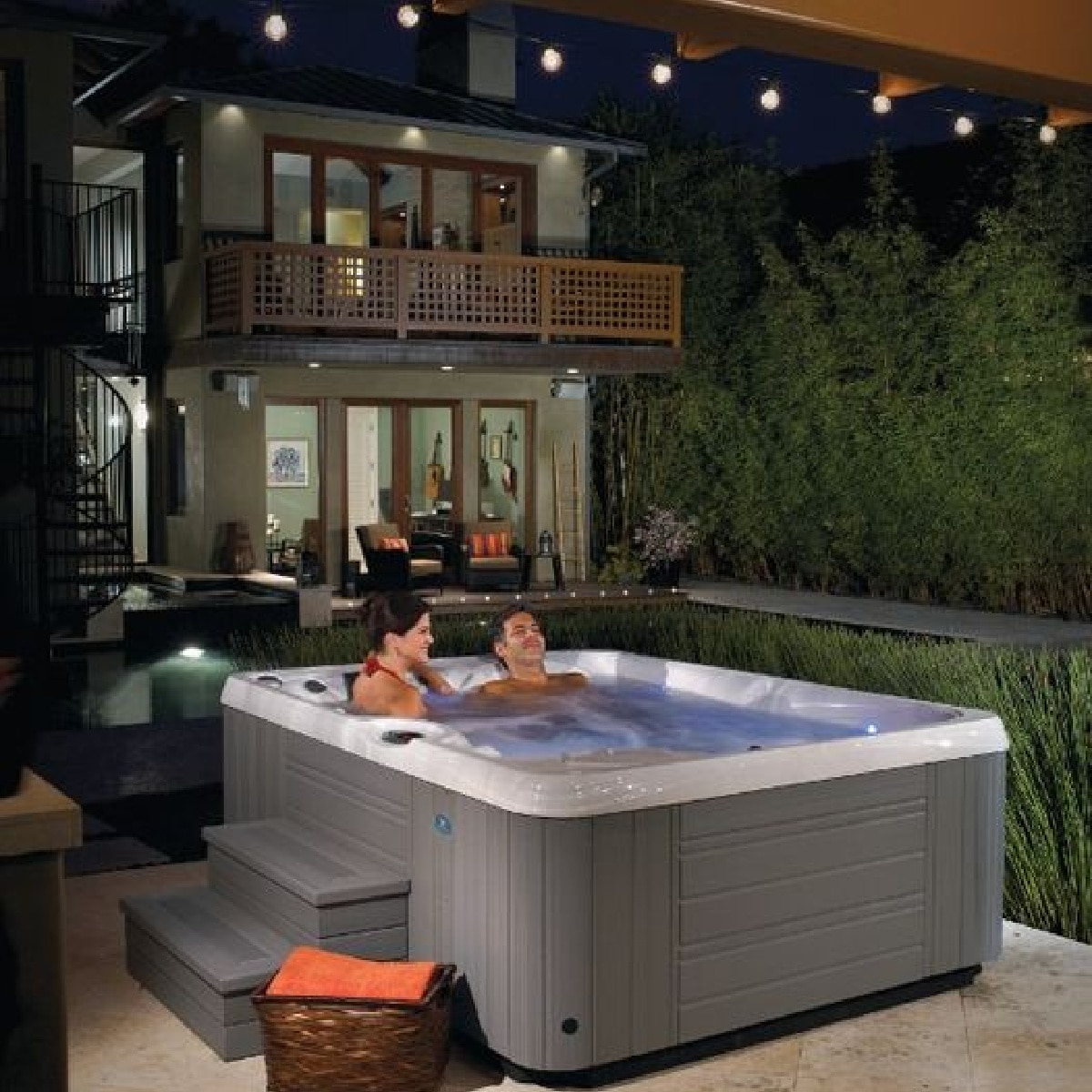 couple using hot tub at night in fall