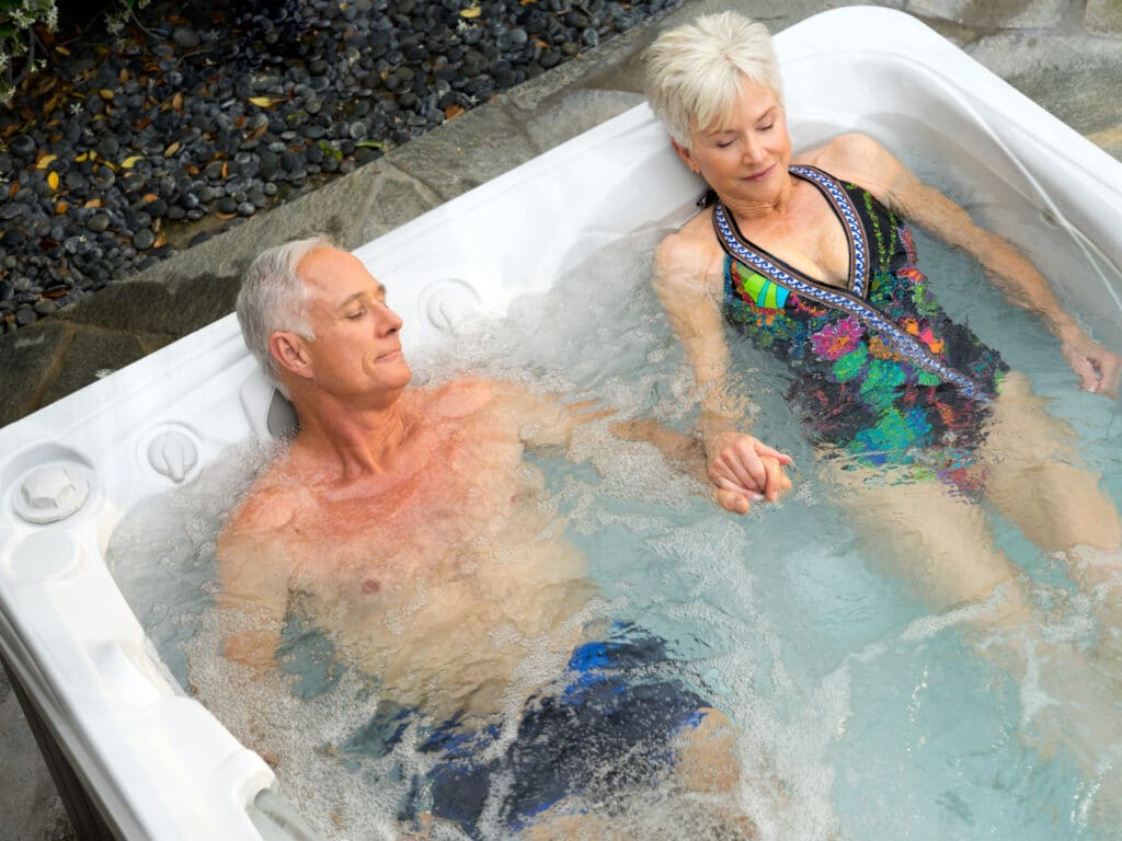 couple in the right size hot tub